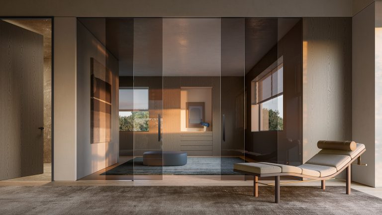 Porta scorrevole in vetro fume' su una zona living con chaise longue, luce calda